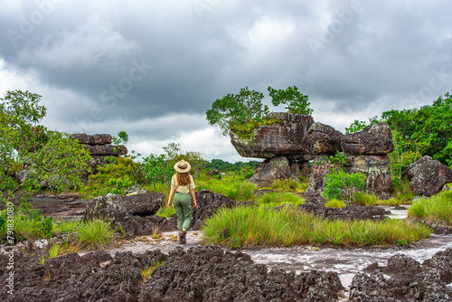 Woman exploring the tunnel nature reserve in San José del Guaviare, Colombia photo