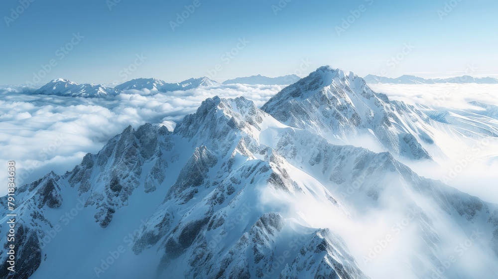 A stunning photograph of the snowcovered Andes range, showcasing breathtaking mountain scenery in New Zealand's Alps,The towering peaks rise above clouds and mist.