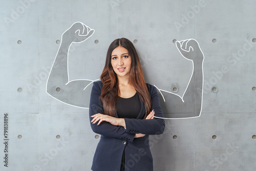 Fotografie Happy young middle east business woman posing isolated over grey wall background
