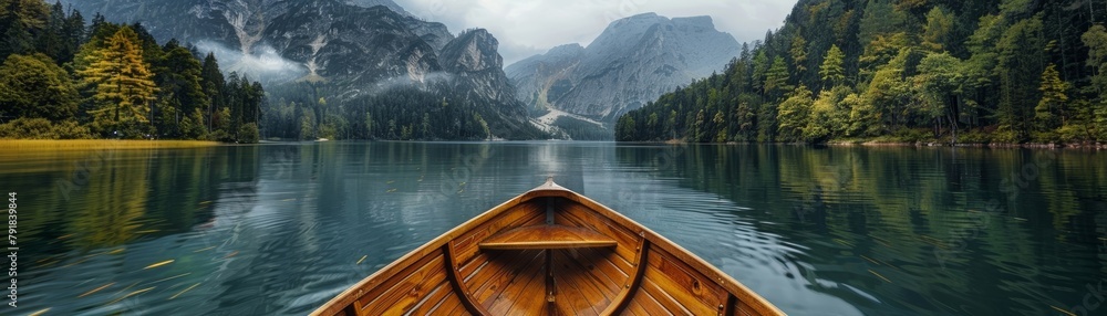 The serene scenery of a rustic wooden canoe on a tranquil mountain lake. AI-generated. The serene scenery of a rustic wooden canoe on a tranquil mountain lake. AI-generated.