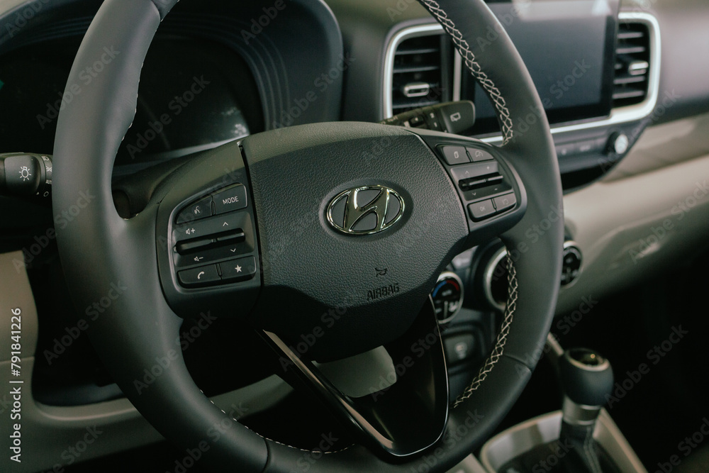 Car interior with logo Hyundai. New car steering wheel. Elegant classic ...