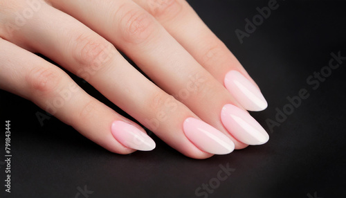 Wallpaper Mural hand with natural nude manicure on black background close up Torontodigital.ca