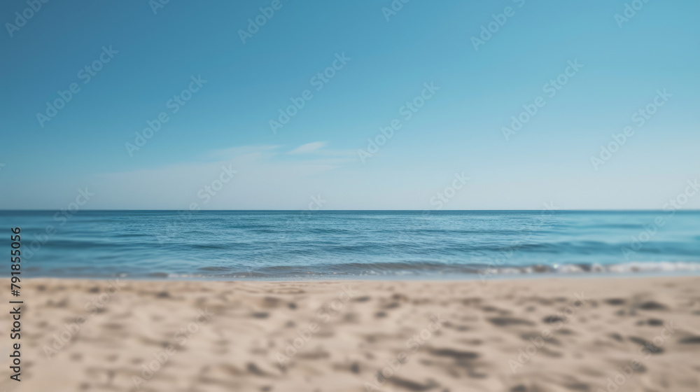 Simple, blurry background of a sandy beach and calm sea. Simple, blurry background of a sandy beach and calm sea.