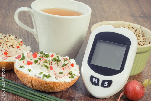 Canvas Print Glucometer for checking sugar level, freshly breakfast with tea