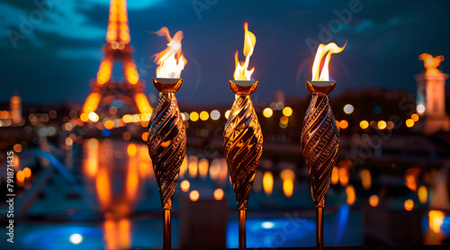 commencement torch gold silver bronze, eiffel tower background