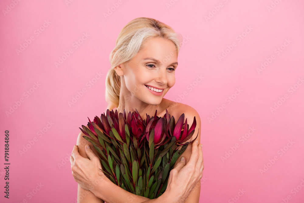 Photo of stunning attractive lady hold flower bunch feel self love acceptance treatment isolated on pink color background