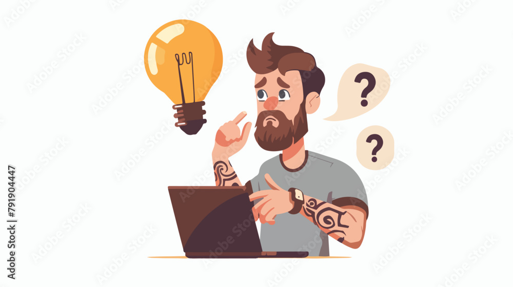Young man with beard and tattoo before working on laptop with new idea