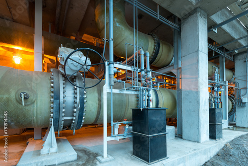 Water pipes and pumps at a reverse osmosis desalination plant.