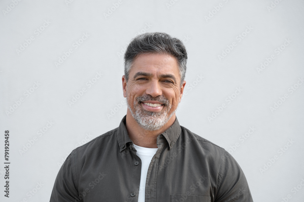 Closeup face headshot portrait of middle age mature adult man. Freelancer entrepreneur isolated on white background. Happy smiling handsome 40 years old latin hispanic businessman looking at camera Closeup face headshot portrait of middle age mature adult man. Freelancer entrepreneur isolated on white background. Happy smiling handsome 40 years old latin hispanic businessman looking at camera