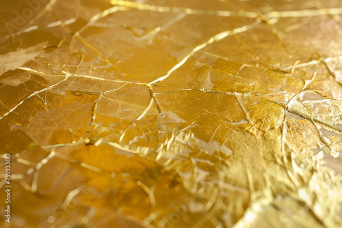 The intricate detail and shimmering texture of gold leaf applied to a surface - Generative AI