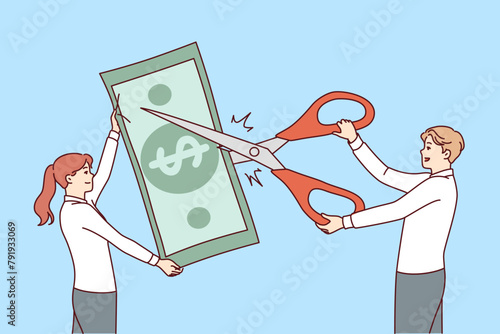 Business people are engaged in reducing costs and budget financing by cutting money with scissors. Concept of stopping financing of disadvantageous projects or unprofitable departments of company photo