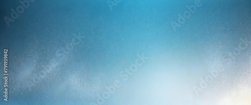 A serene blue gradient background resembling a misty glass surface with water droplets scattered throughout Perfect for calm and peaceful concepts photo