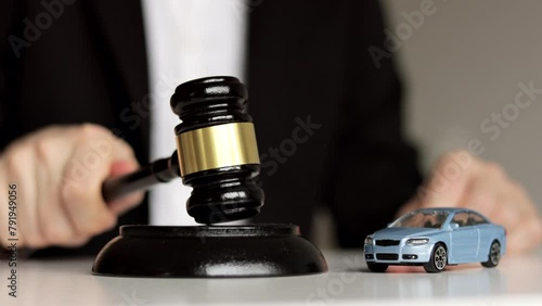 Car Accident Liability Insurance Lawyer And Gavel. Judge's hand banging a gavel. photo