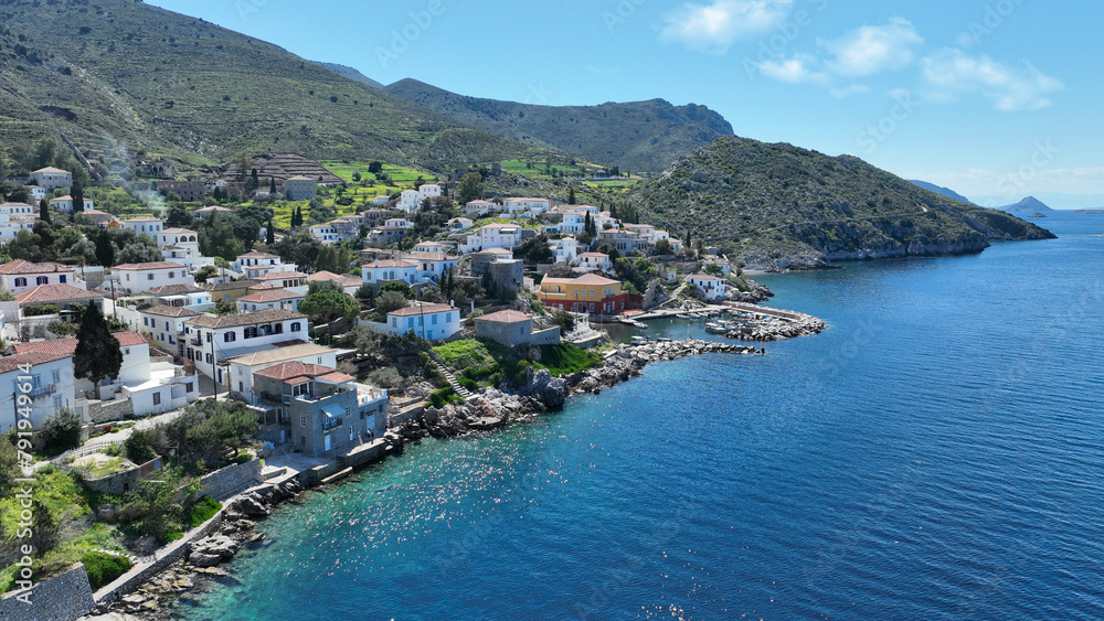 Aerial drone photo of small picturesque seaside village and harbour of Kaminia located near main village of Hydra island accessible by footpath, Saronic gulf, Greece