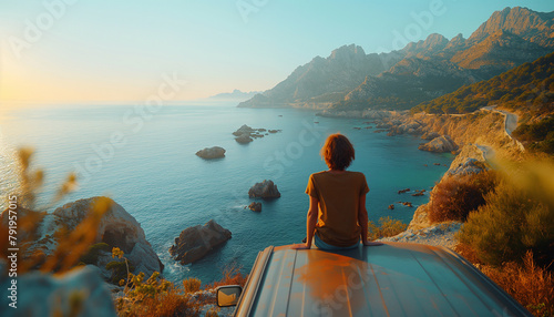Solitude at sunset  Alone Woman person sits on a van roof  gazing at serene rocky coastal scenery. Tranquil moment  travel adventure  scenic beauty and traveling concept.