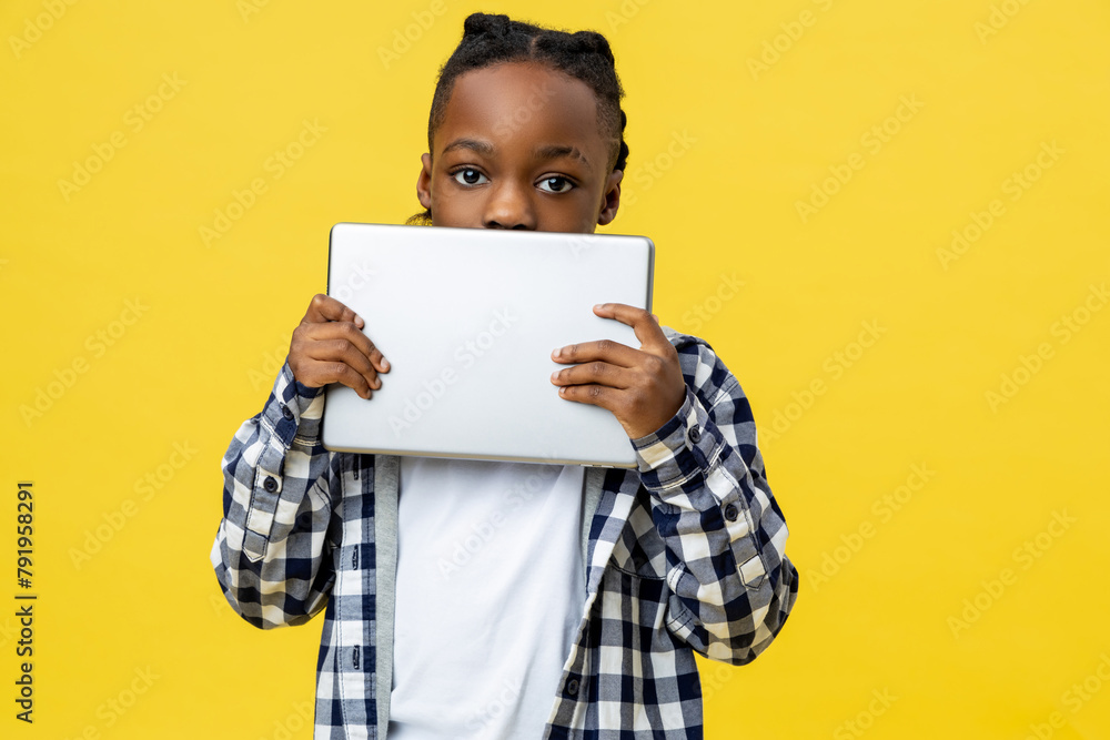 African american boy in checkered shirt with tablet in hands African american boy in checkered shirt with tablet in hands