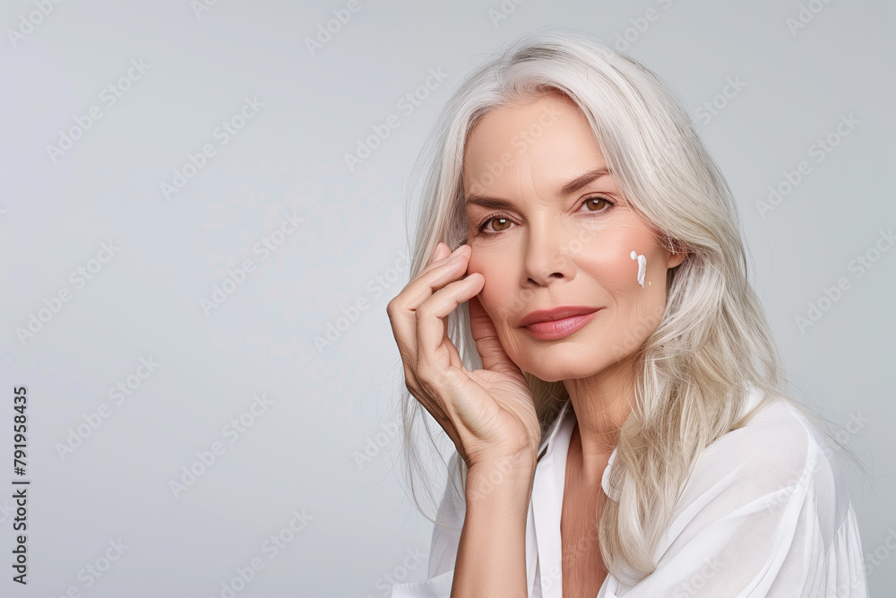 Graceful Aging: Senior Woman with Skin Cream Graceful Aging: Senior Woman with Skin Cream