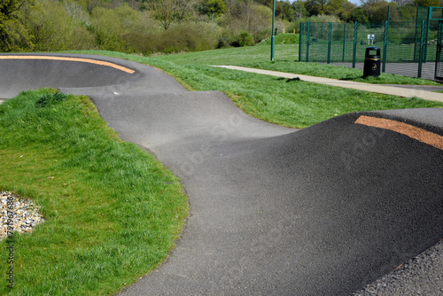 Bike track for riding bmx or mountain bikes with jumps and corners to cycle over on a smooth surface for sporting and race events