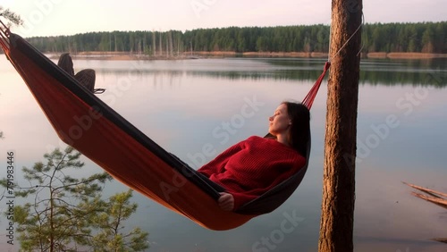 Wallpaper Mural Relaxed woman lying in hammock in forest enjoy admiring lake nature at sunset. Resting relaxed young female in red sweater enjoying time in camping in dark woodland. Tourist traveler, camper outdoors. Torontodigital.ca