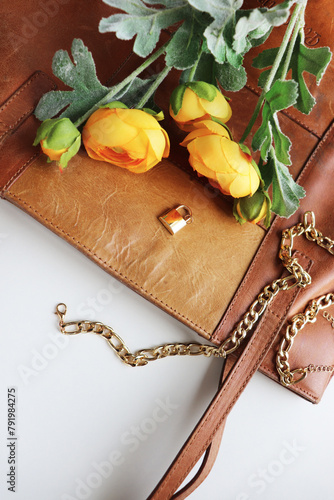 postcard layout. bouquet of flowers and gold jewelry