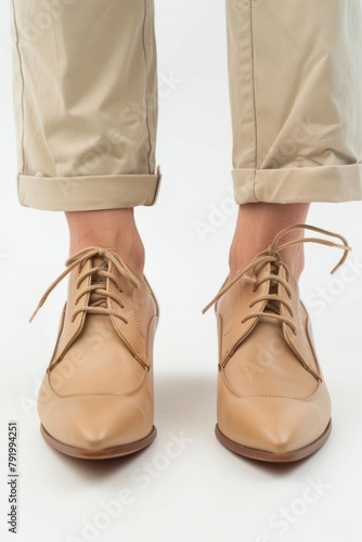 Person wearing tan shoes close up