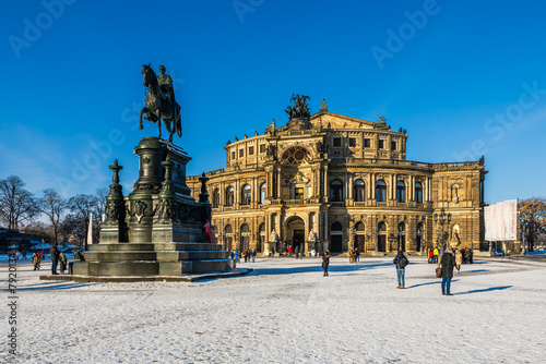 The Dresden square Theaterplatz in front of the Semperoper full of people on a cold winter day