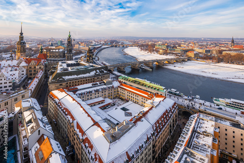 The Dresden and Elbe river cityscape covered in snow on a cold winter day in late afternoon.