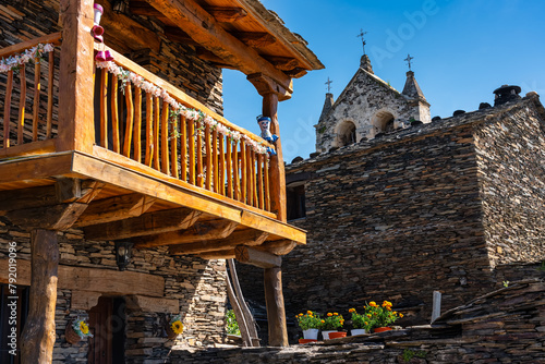 Wooden balconies and stone houses on the route of the black villages, Guadalajara, Majaelrayo. photo
