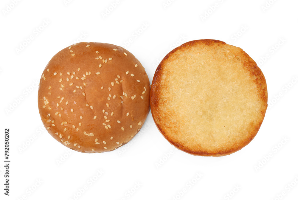 Halves of grilled burger bun isolated on white, top view