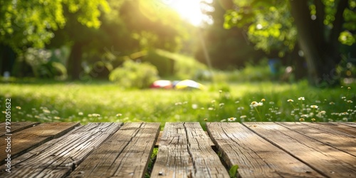 Empty wooden table in summe...