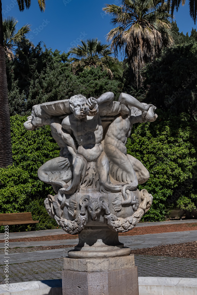 Triton Fountain (La fontaine des Tritons) in Nice Albert I Garden. Fountain consists of four tritons supporting a large bowl made of white marble. French riviera, Cote d'Azur, Nice, France.
