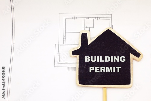 Building Permit concept with imaginary building approvation and residential home icon photo