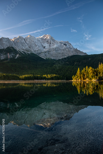Lake eibsee at dawn with still water reflection