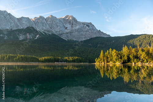 Lake eibsee at dawn with still water reflection