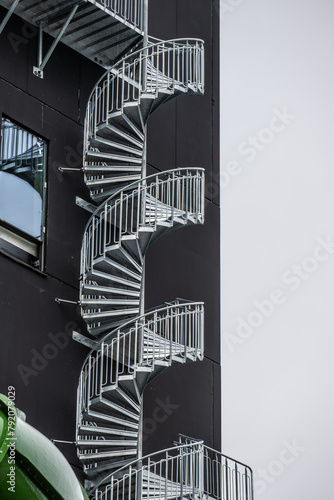 Escape staircase outside a tall building.