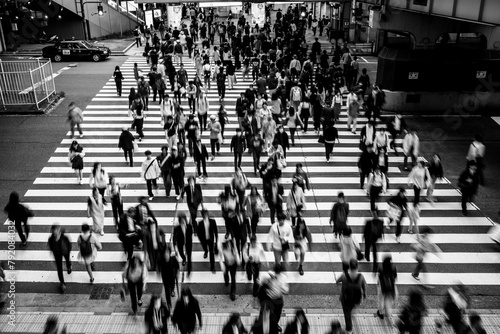 大阪梅田の繁華街で横断歩道を渡る人々。モノクロでブらせて撮影 photo