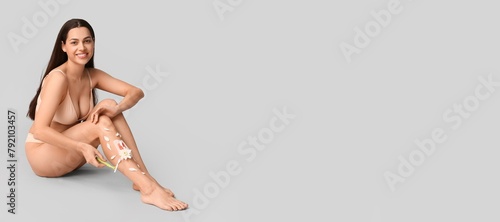 Young woman with razor, wax...