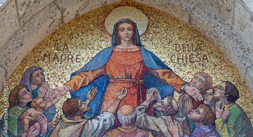 MILAN, ITALY - MARCH 7, 2024: The exterior mosaic of VIrgin Mary over the entry of the church Chiesa di Santa Maria del Rosario designed by Gian Luigi Uboldi (1915-2005).