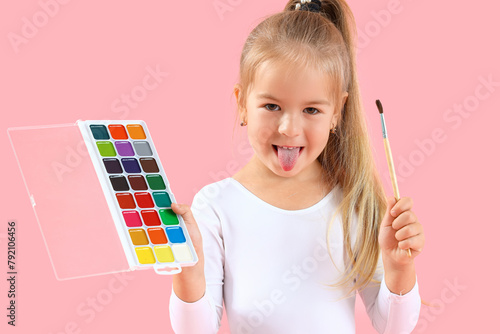 Cute little girl with paint...