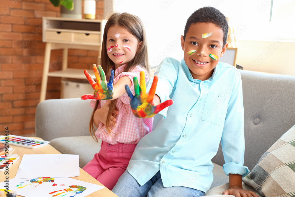 Cute little children in paint at home Cute little children in paint at home