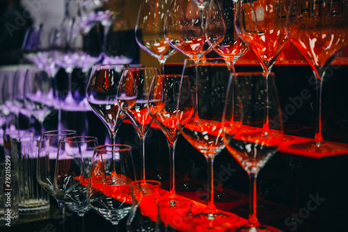 Different wine glasses ready for wine tasting in a bar of restaurant or wine expo.