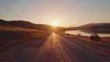 adventurethemed empty road leading to lake at sunset stunning landscape vista