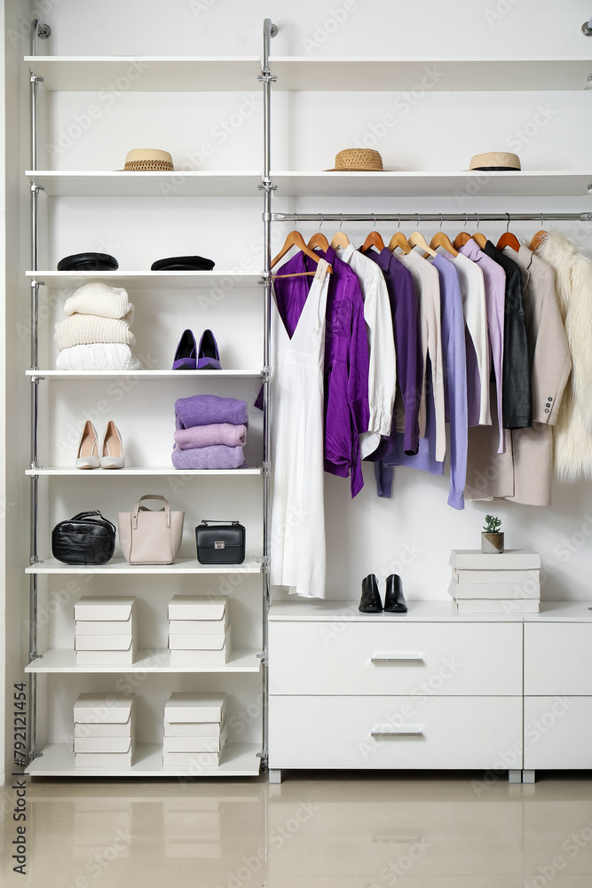 Stylish woman's wardrobe with clothes and accessories