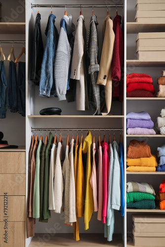 Rack with stylish coats in modern woman's wardrobe © Pixel-Shot