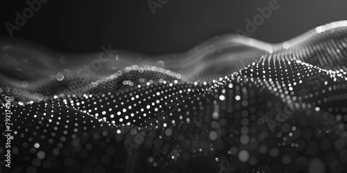 Abstract black and white image of a dynamic wave pattern formed by illuminated dots, creating a sense of motion and fluidity. photo