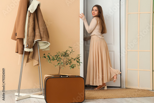 Young woman walking away th...