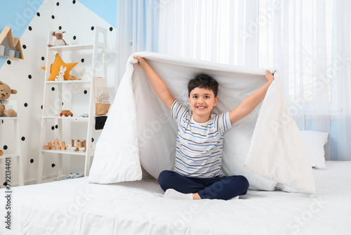 Cute happy little boy with ...