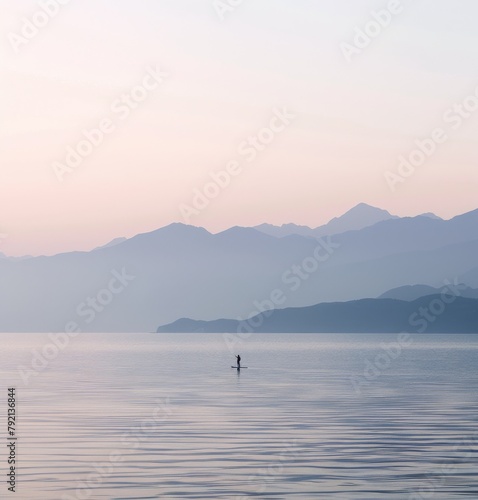 Person Standing on Surfboard in Water