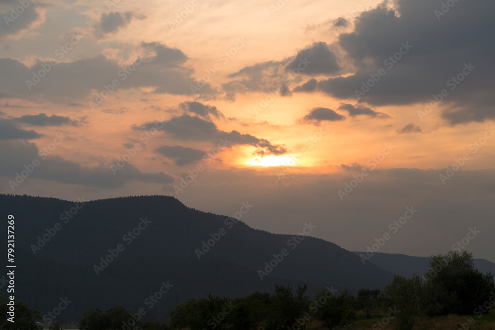 Sunset over the town of Sarnitsa, located in the Western Rhodope Mountains near the Dospat Reservoir.