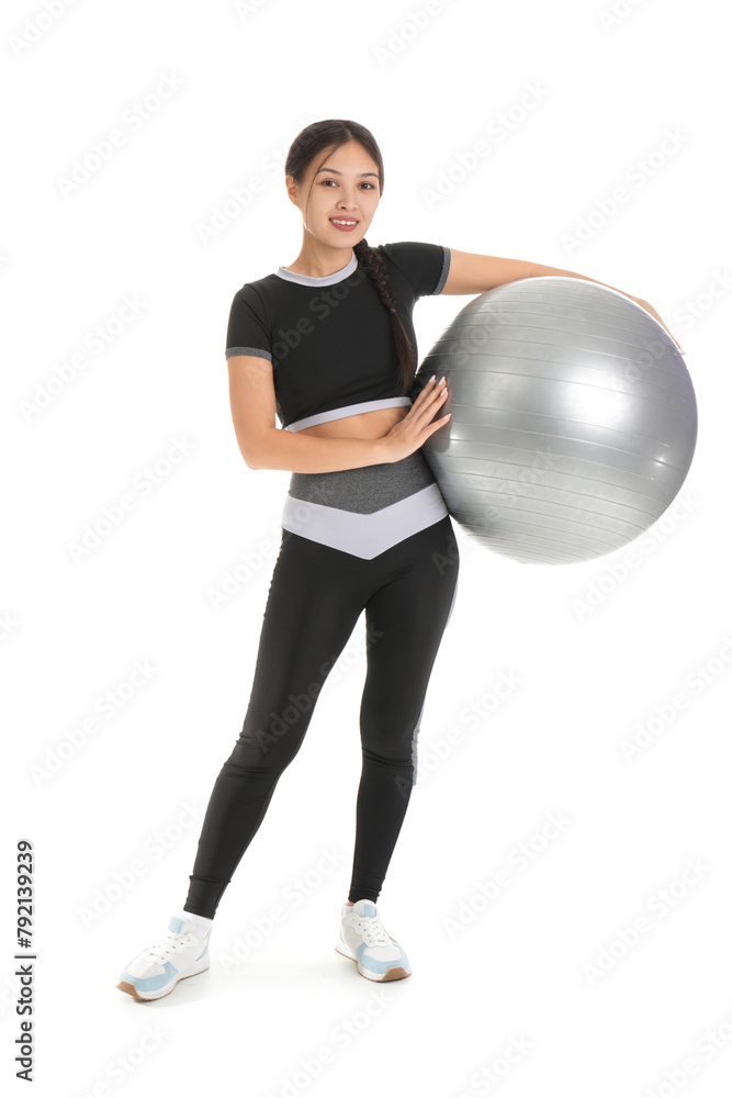 Sporty young Asian woman with fitball on white background Sporty young Asian woman with fitball on white background